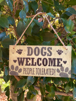 Dogs welcome people tolerated
